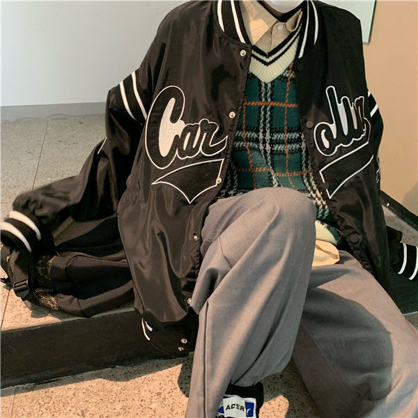 Woman wearing loose hip hop jacket with letter print
