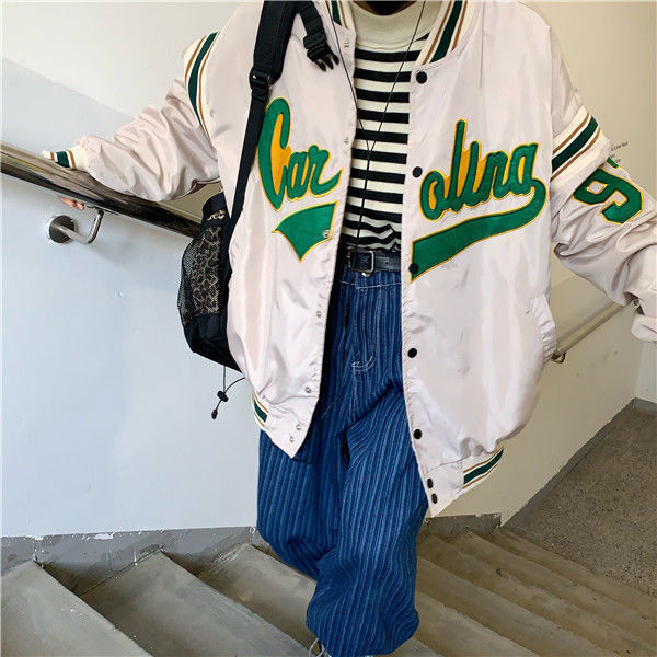 Woman wearing loose hip hop jacket with letter print