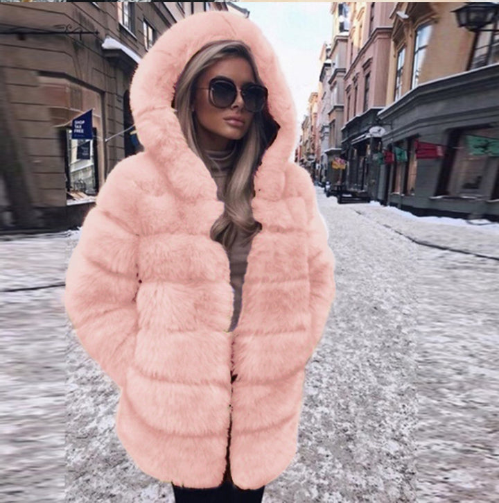 Woman wearing short faux fur coat with long sleeves