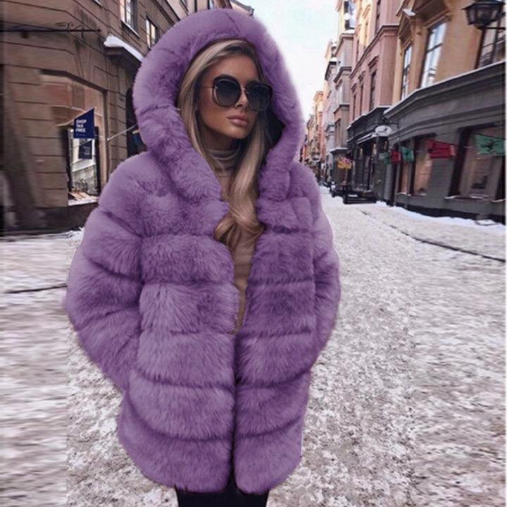 Woman wearing short faux fur coat with long sleeves