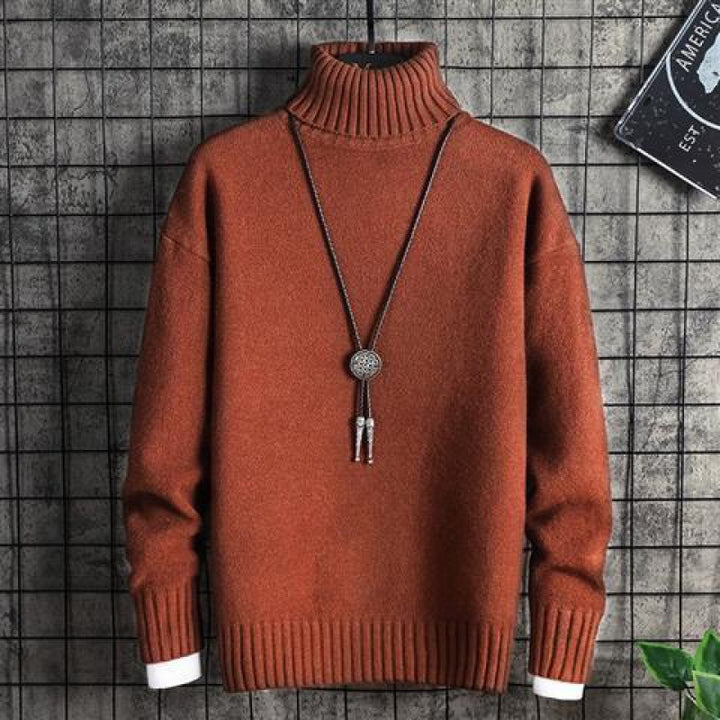 Man wearing black slim fit turtleneck sweater indoors