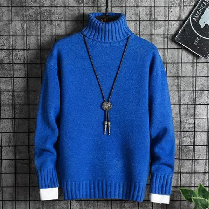 Man wearing black slim fit turtleneck sweater indoors