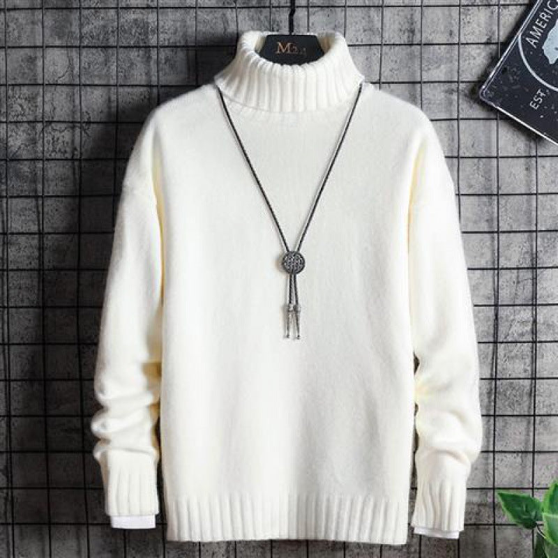 Man wearing black slim fit turtleneck sweater indoors