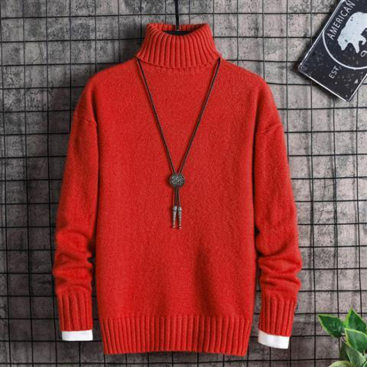 Man wearing black slim fit turtleneck sweater indoors