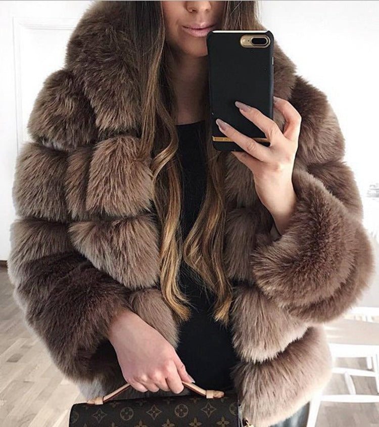 Woman wearing short faux fur coat with long sleeves