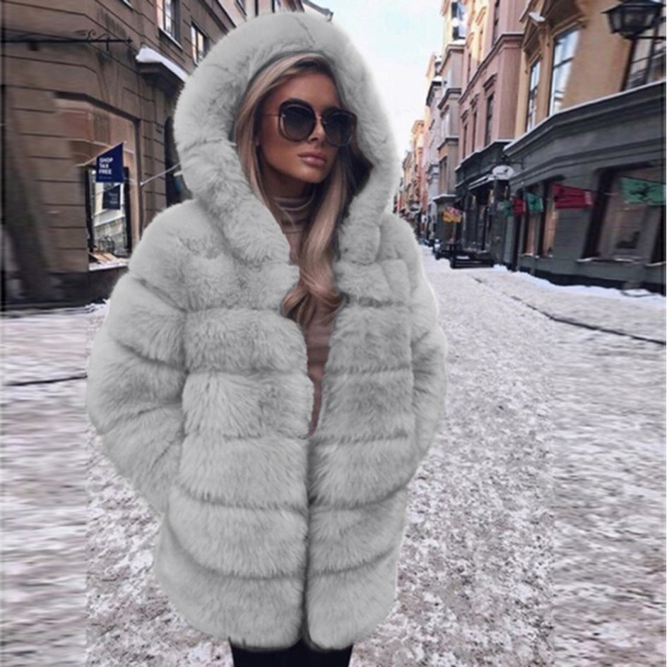 Woman wearing short faux fur coat with long sleeves