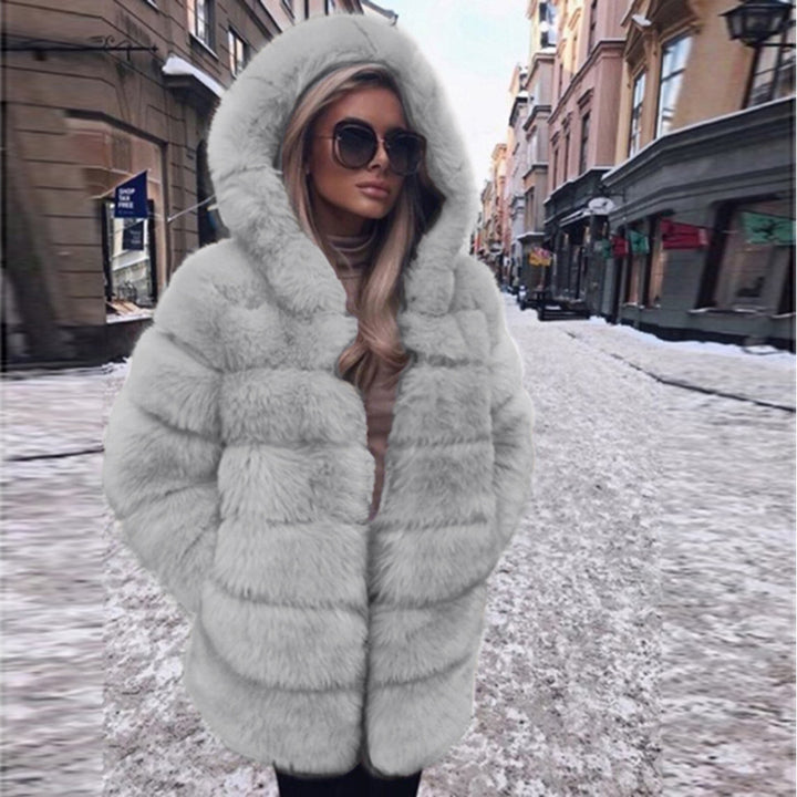Woman wearing short faux fur coat with long sleeves