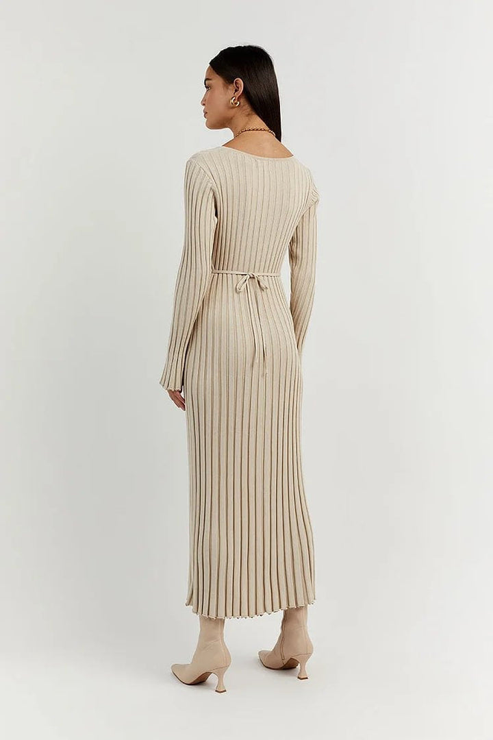 Woman wearing knit V-neck long sleeve dress