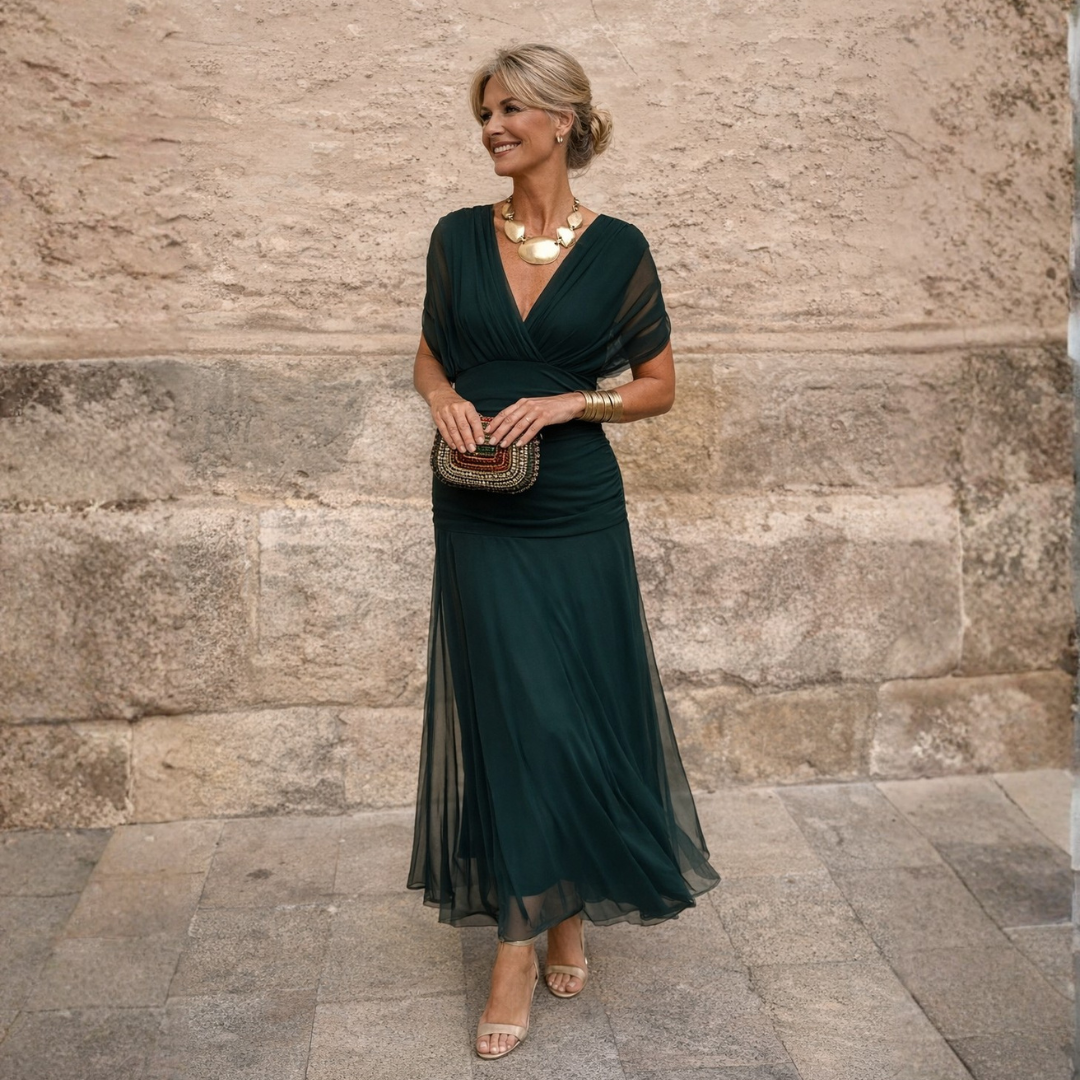 Woman wearing V-neck maxi dress with flowy skirt