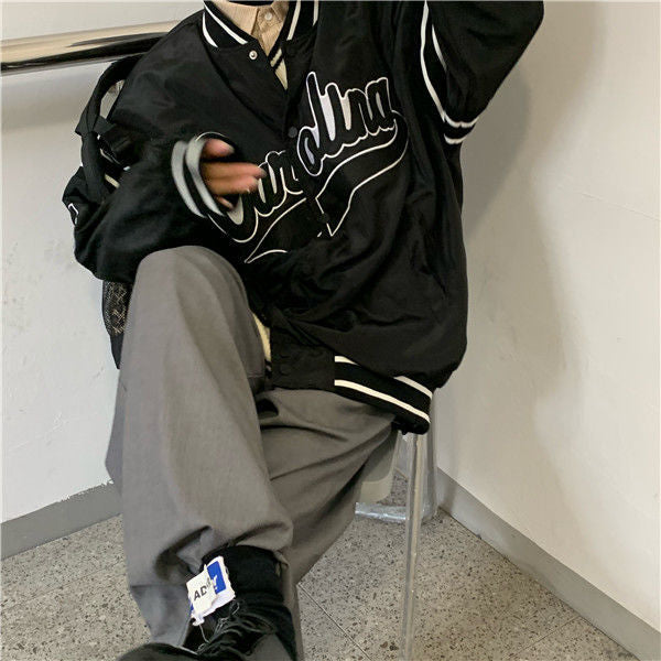 Woman wearing loose hip hop jacket with letter print