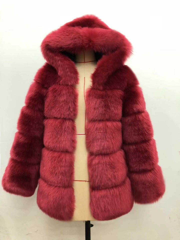 Woman wearing short faux fur coat with long sleeves