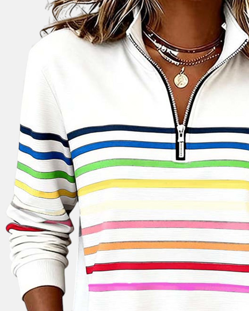Woman wearing rainbow striped half zip sweatshirt
