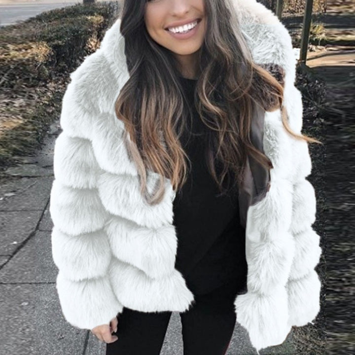 Woman wearing short faux fur coat with long sleeves