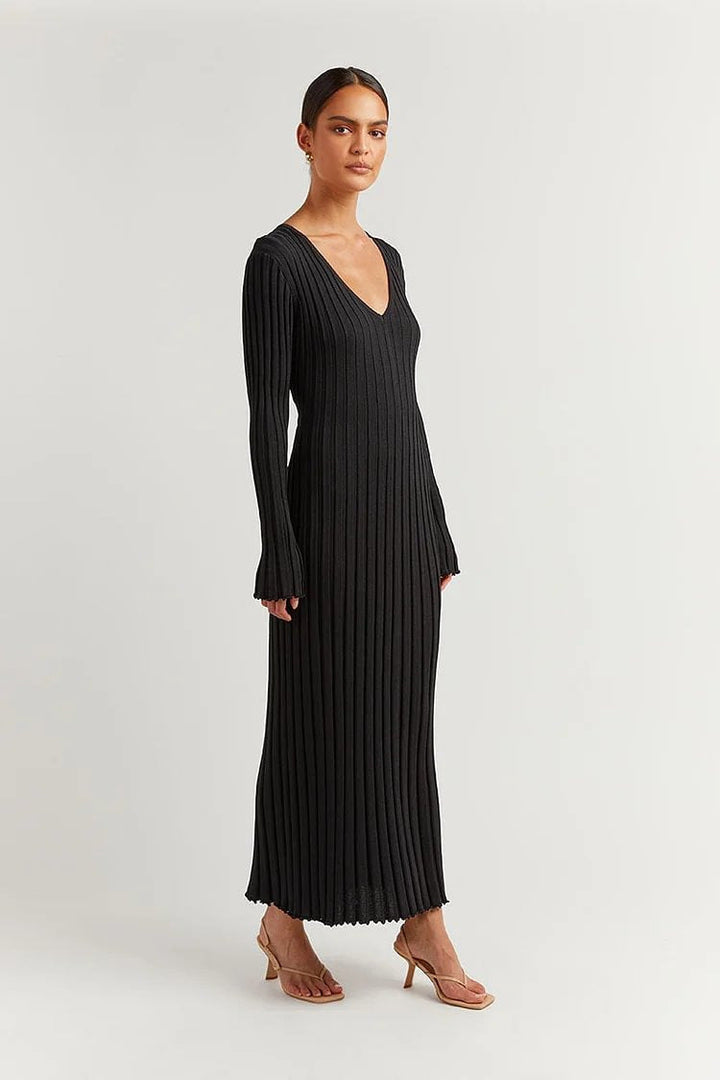 Woman wearing knit V-neck long sleeve dress
