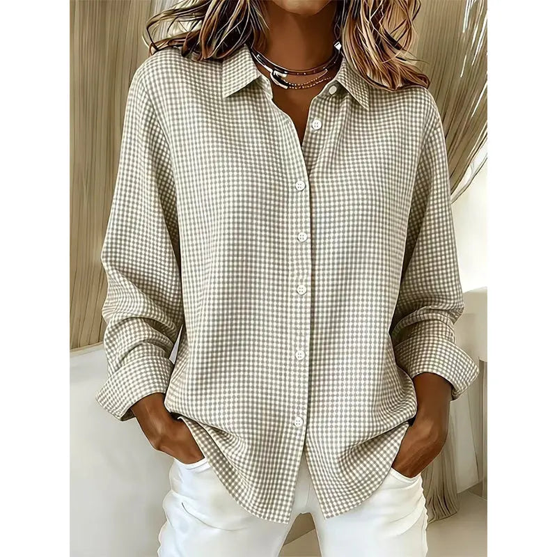 Woman wearing gingham check button-up blouse with long sleeves