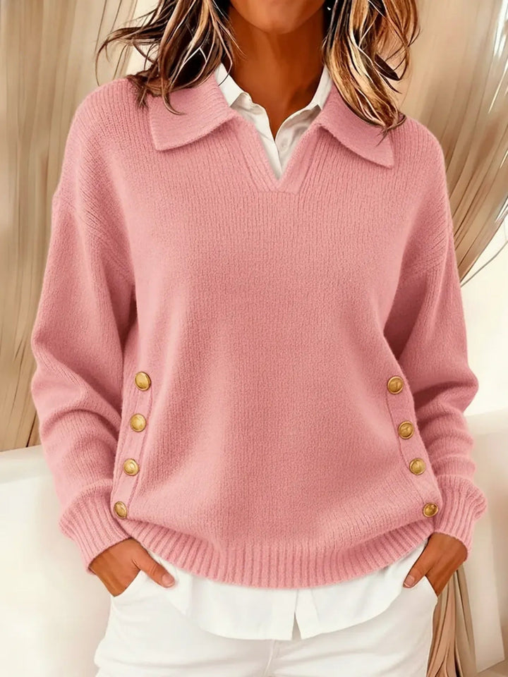 Woman wearing V-neck sweater with collar and gold buttons