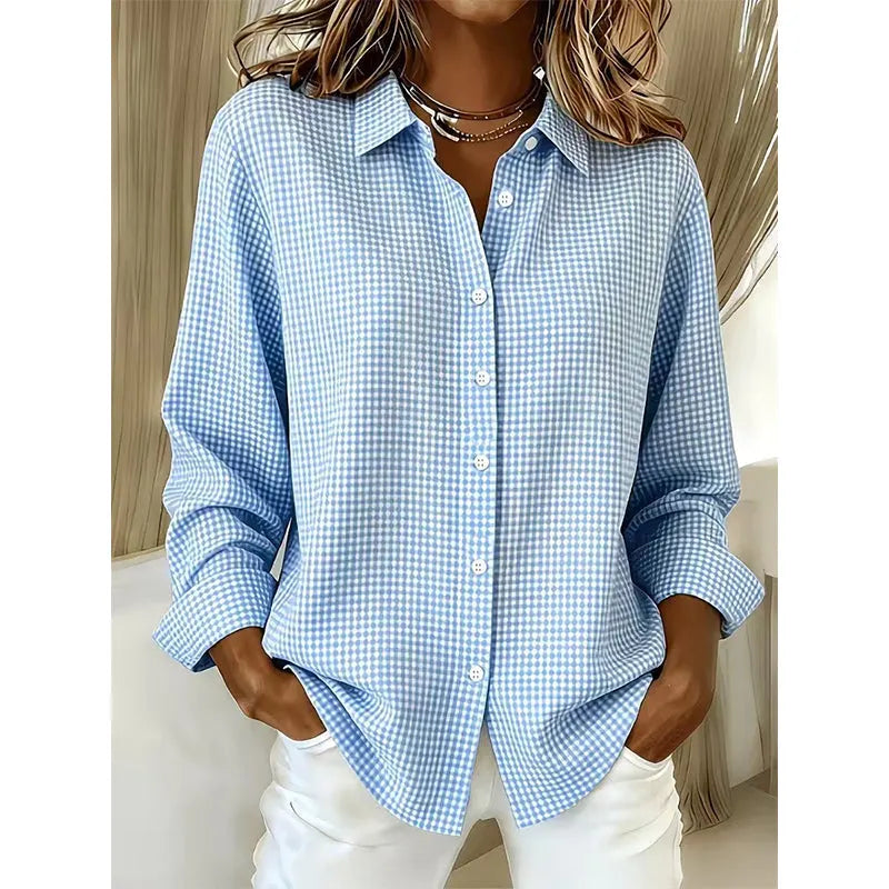 Woman wearing gingham check button-up blouse with long sleeves