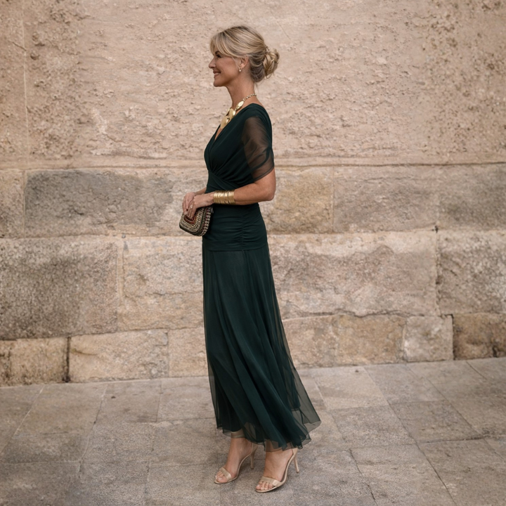Woman wearing V-neck maxi dress with flowy skirt