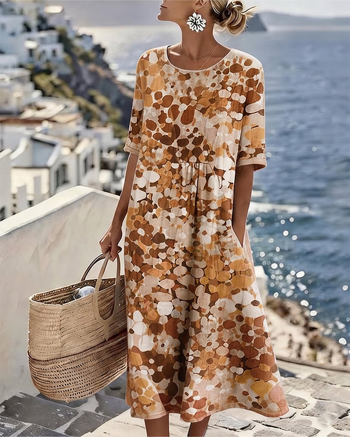 Woman wearing abstract floral print midi dress with short sleeves