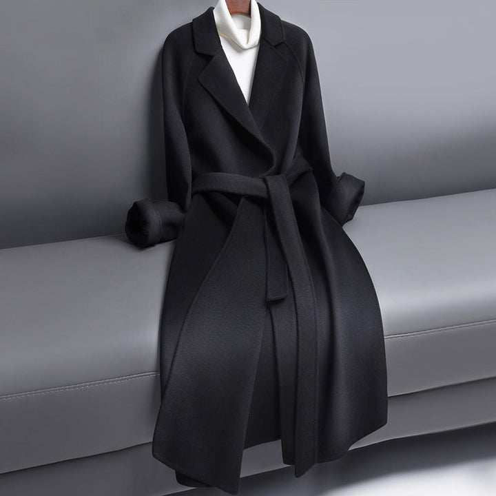 Woman wearing long wool winter coat with belt