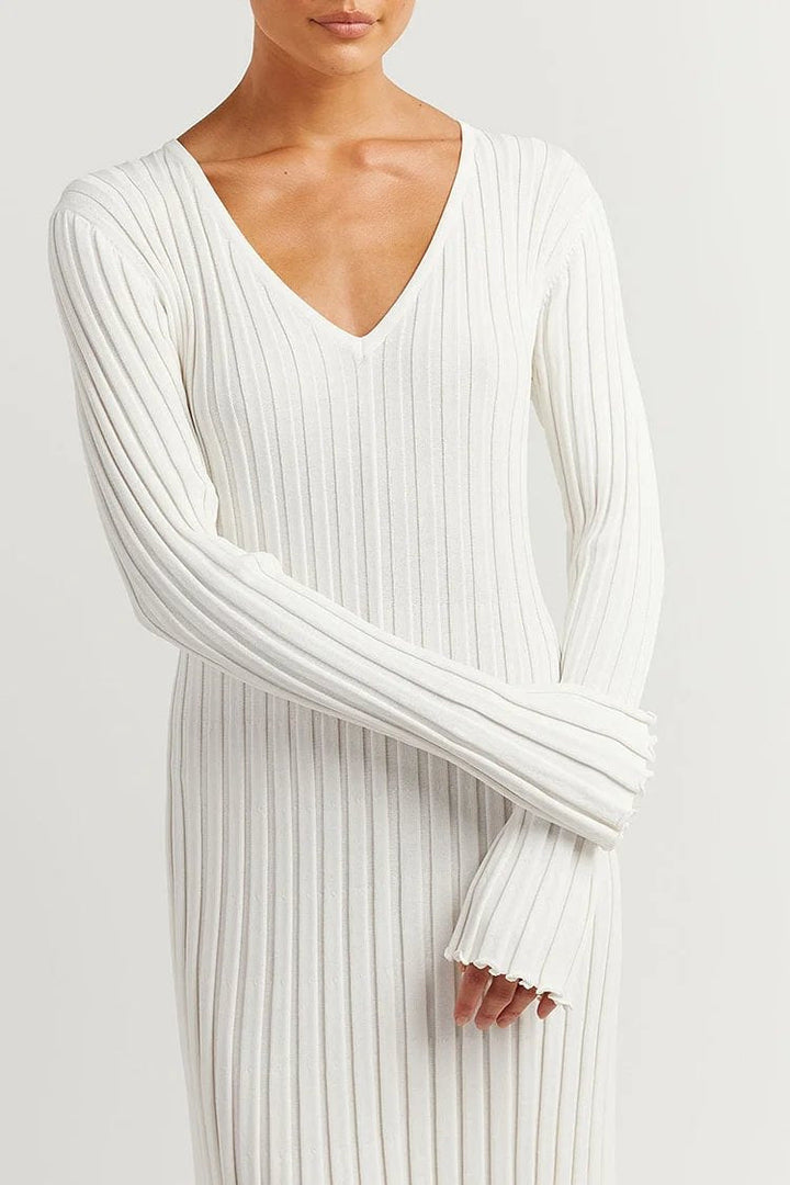 Woman wearing knit V-neck long sleeve dress