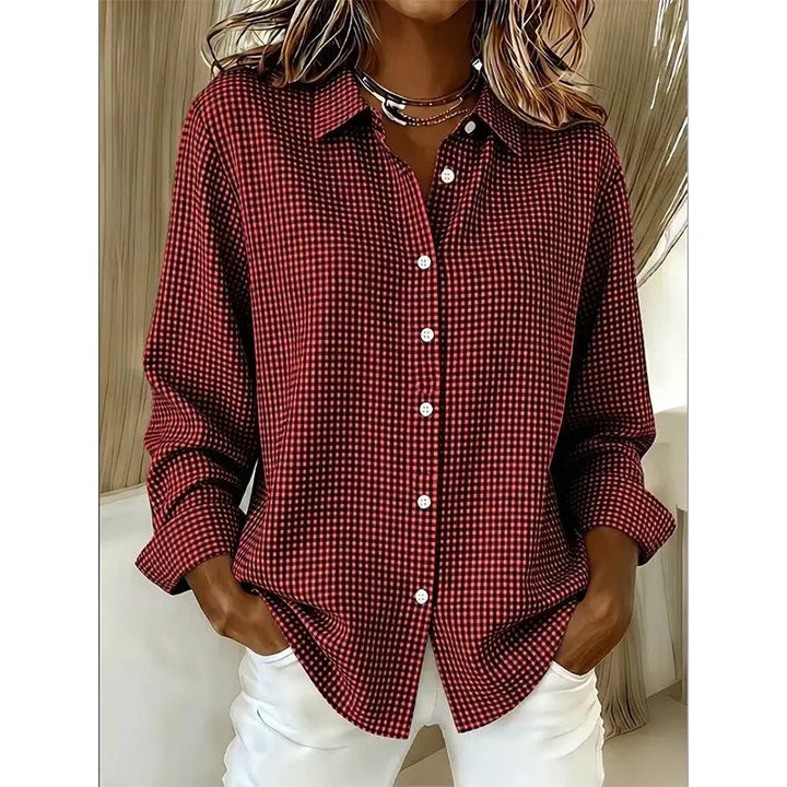 Woman wearing gingham check button-up blouse with long sleeves