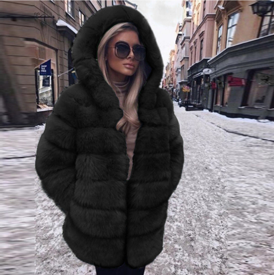 Woman wearing short faux fur coat with long sleeves