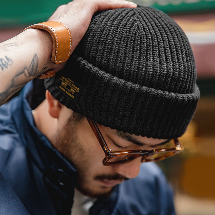 Black knitted beanie with vintage melon skin pattern