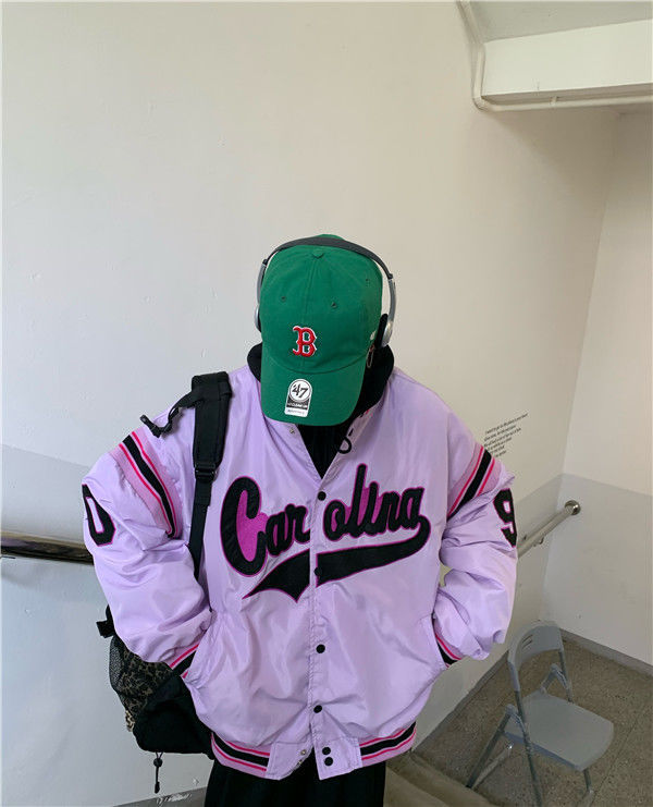 Woman wearing loose hip hop jacket with letter print