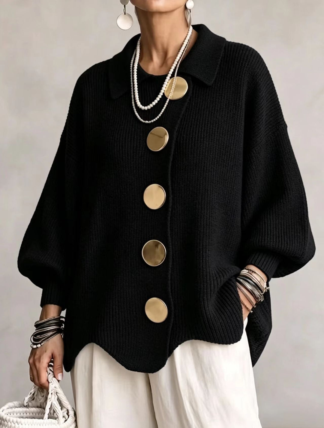Woman wearing oversized cardigan with lantern sleeves