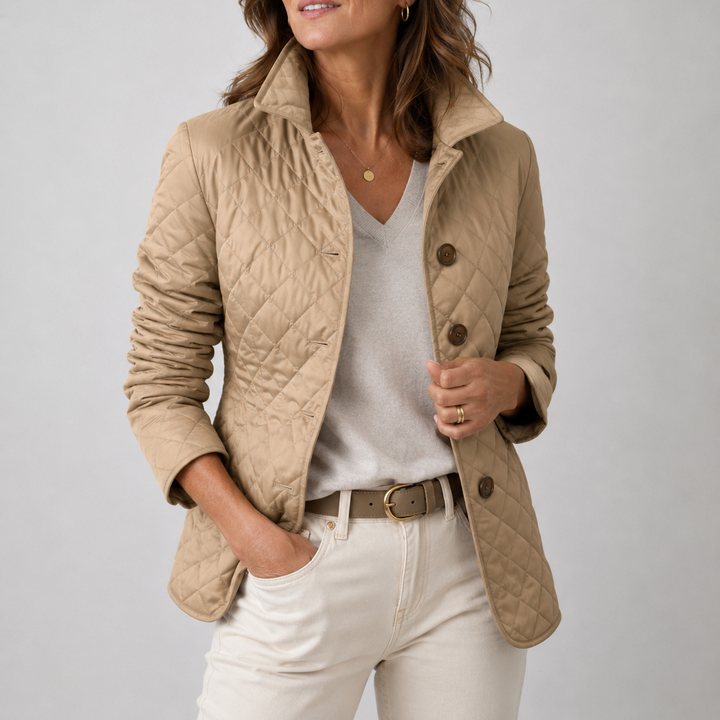 Woman wearing a quilted button front jacket with stand collar