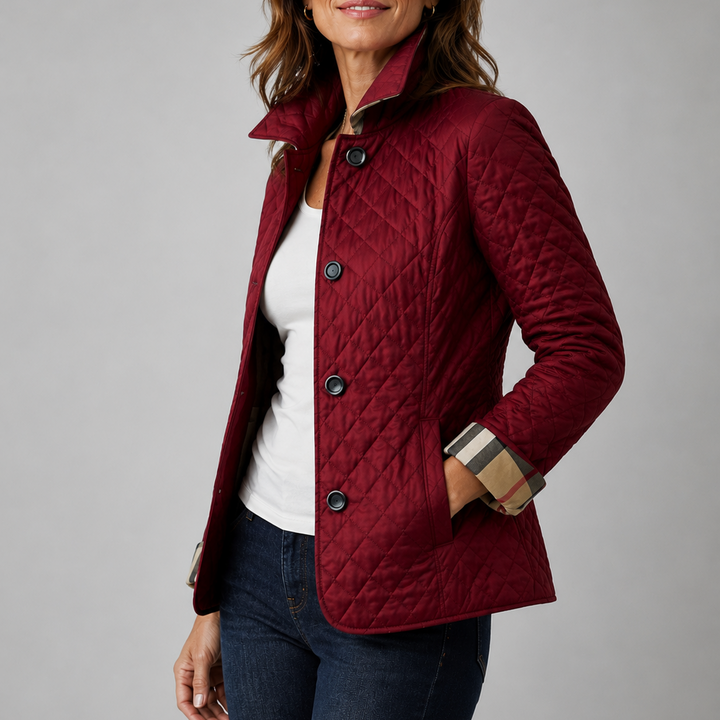 Woman wearing a quilted button front jacket with stand collar