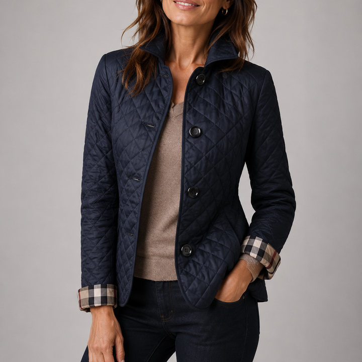 Woman wearing a quilted button front jacket with stand collar
