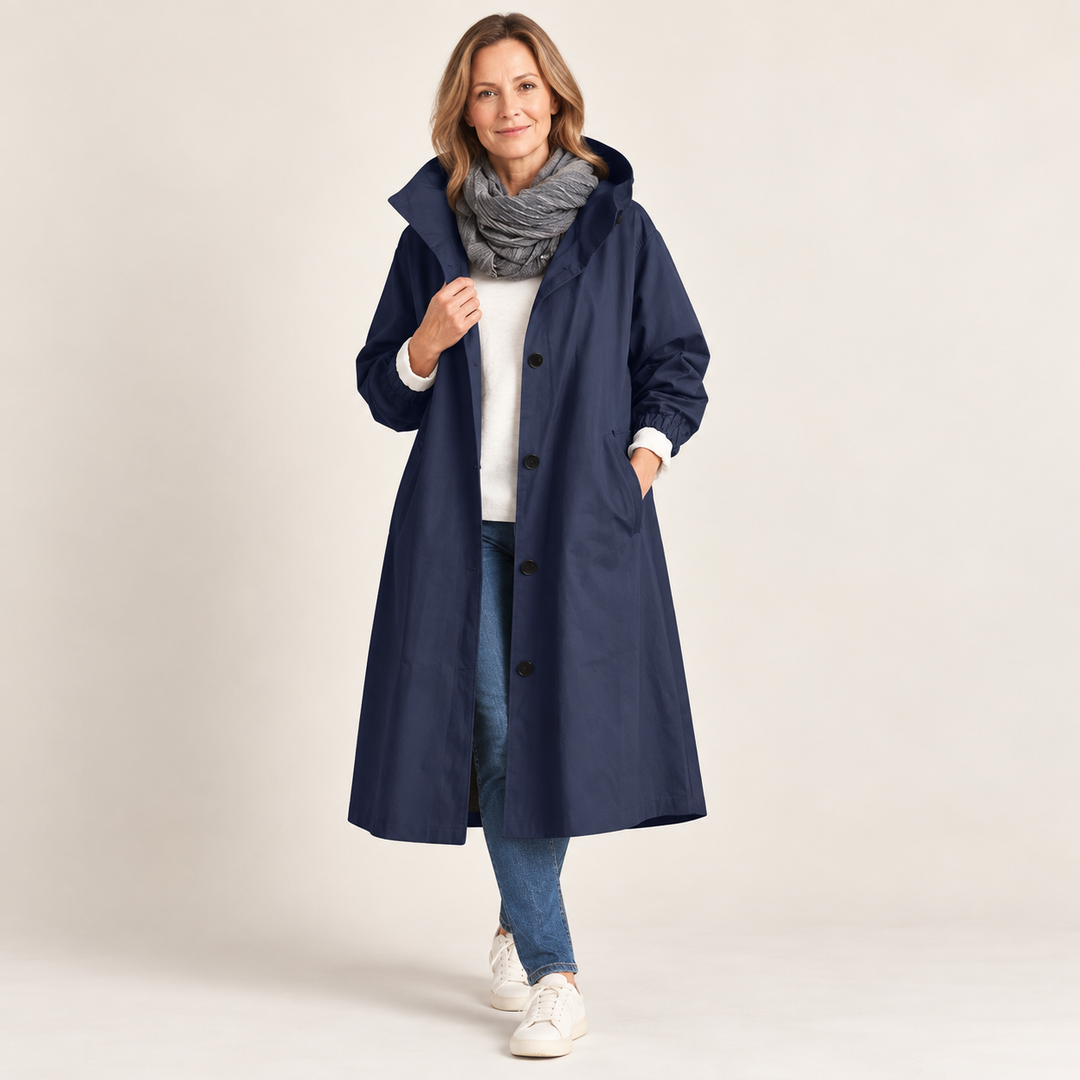 Woman wearing long hooded coat with button front