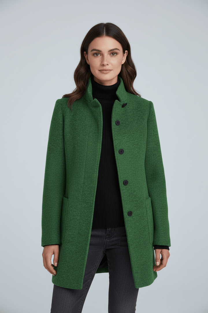 Woman wearing tailored overcoat with stand collar