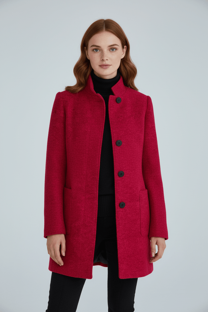 Woman wearing tailored overcoat with stand collar