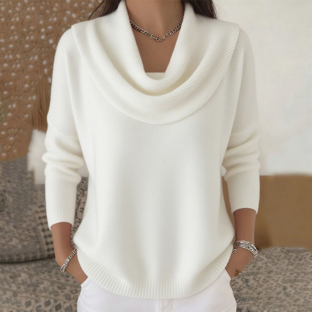 Woman wearing cowl neck knit sweater with relaxed fit
