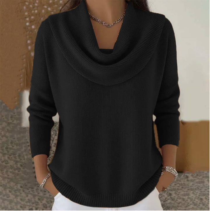 Woman wearing cowl neck knit sweater with relaxed fit
