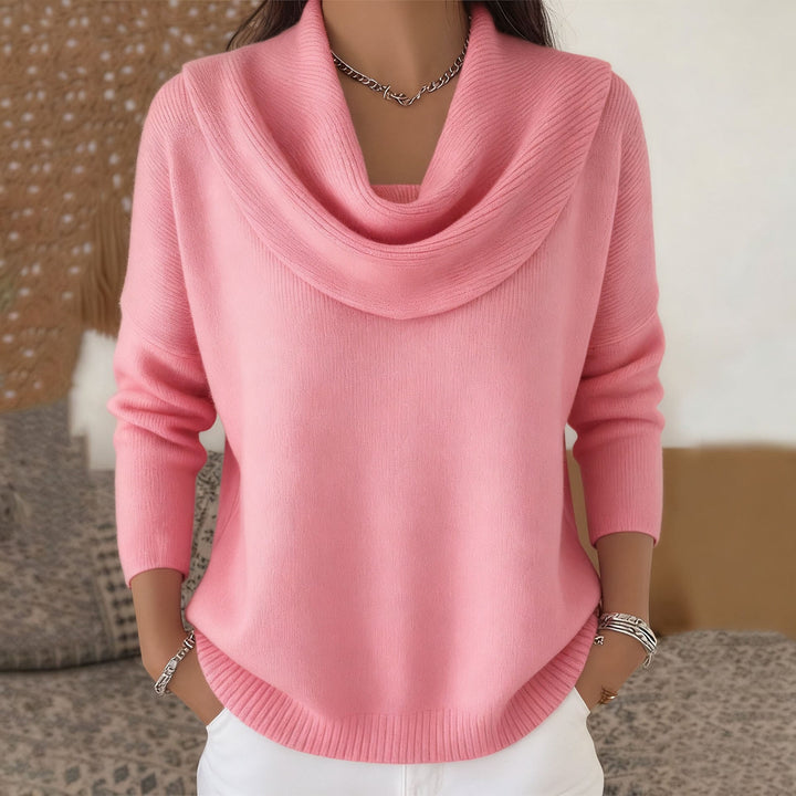 Woman wearing cowl neck knit sweater with relaxed fit