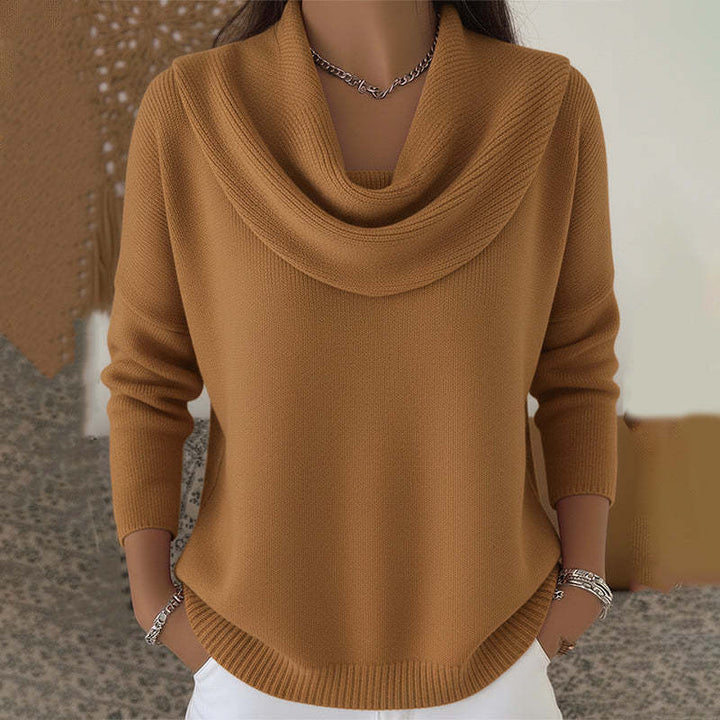 Woman wearing cowl neck knit sweater with relaxed fit