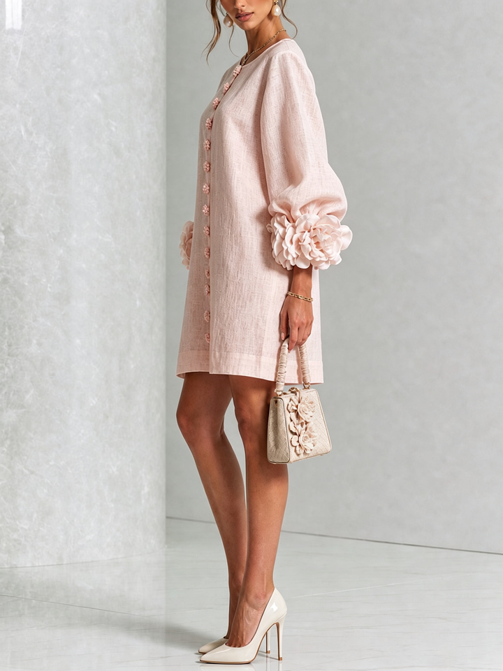 Pink mini dress with button front and rosette cuffs