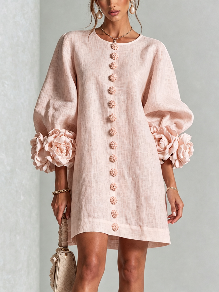 Pink mini dress with button front and rosette cuffs