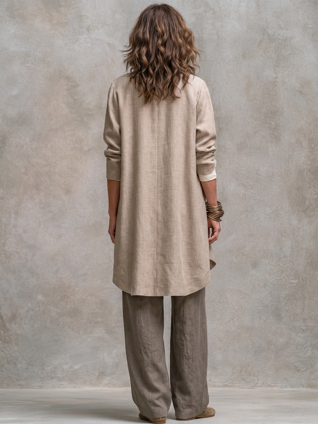 Woman wearing taupe three-piece wide leg pant set outdoors