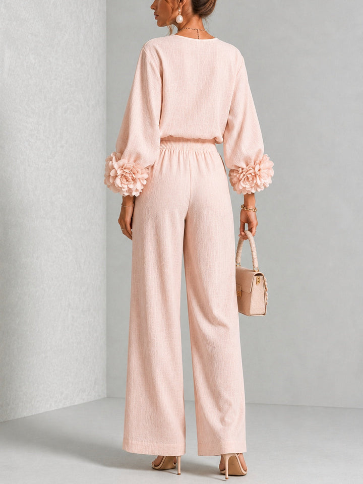 Woman wearing floral two-piece set with wide-leg pants