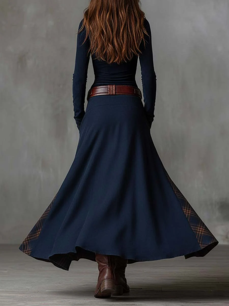 Woman wearing patchwork maxi dress with button front and belt