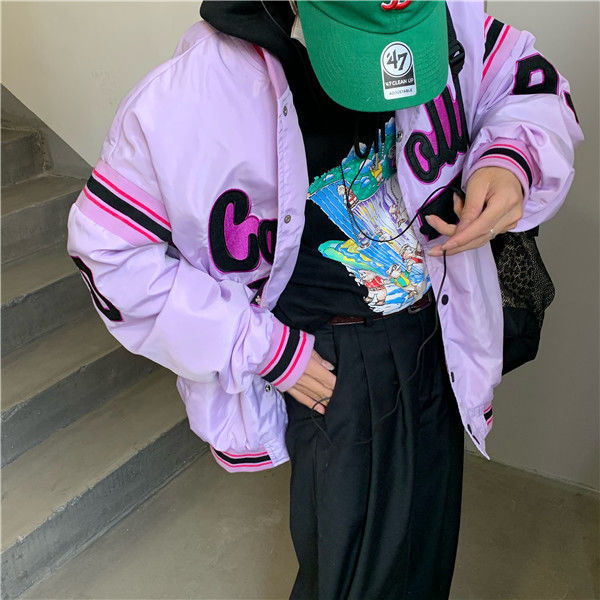 Woman wearing loose hip hop jacket with letter print