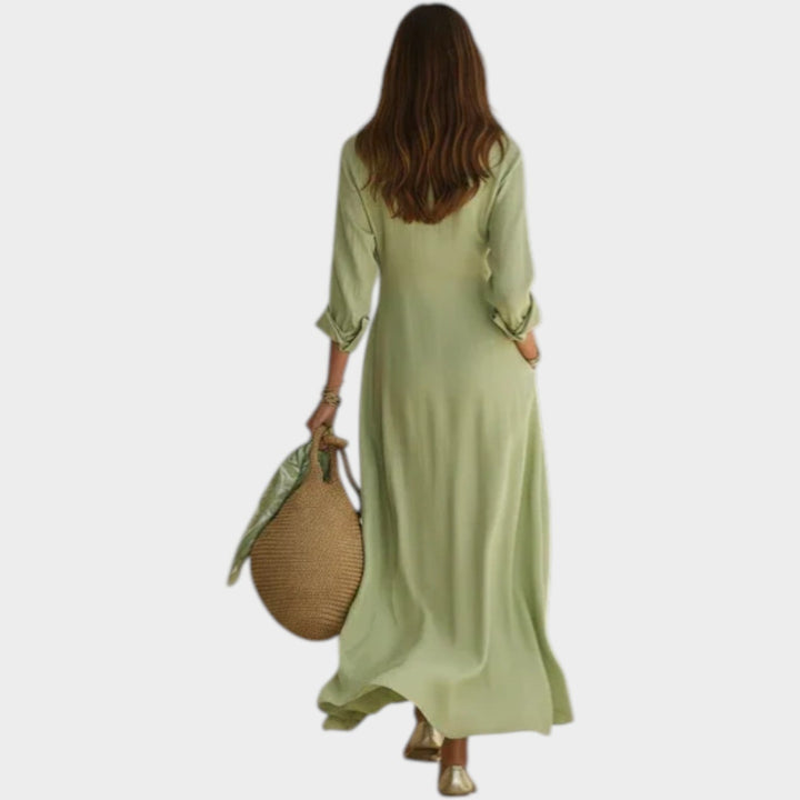 Woman wearing button-front maxi dress with long sleeves