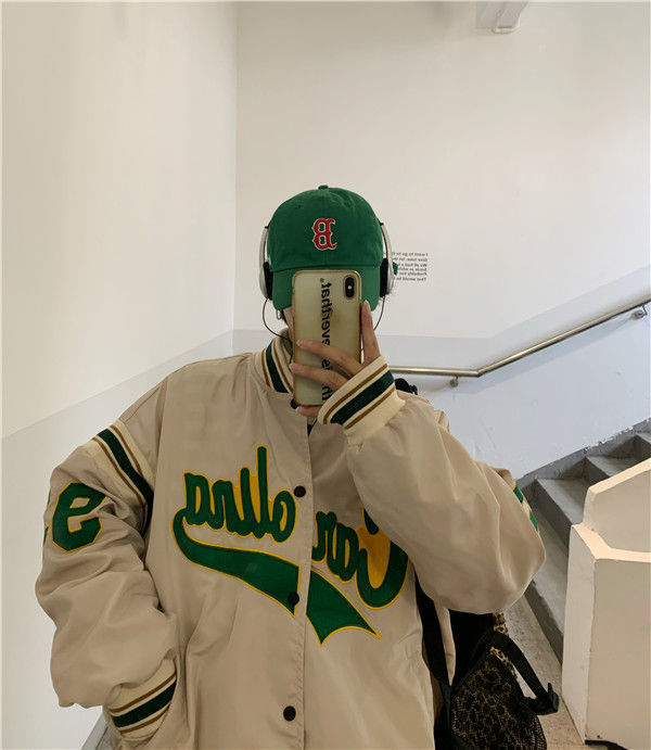 Woman wearing loose hip hop jacket with letter print