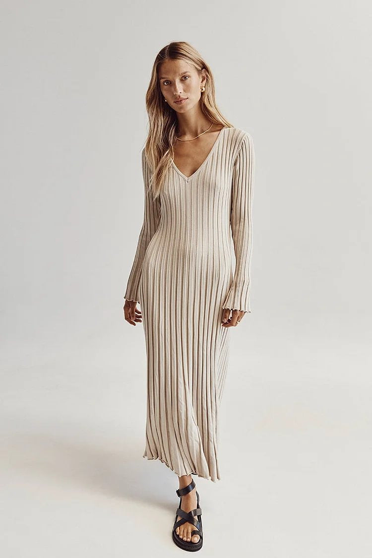Woman wearing knit V-neck long sleeve dress