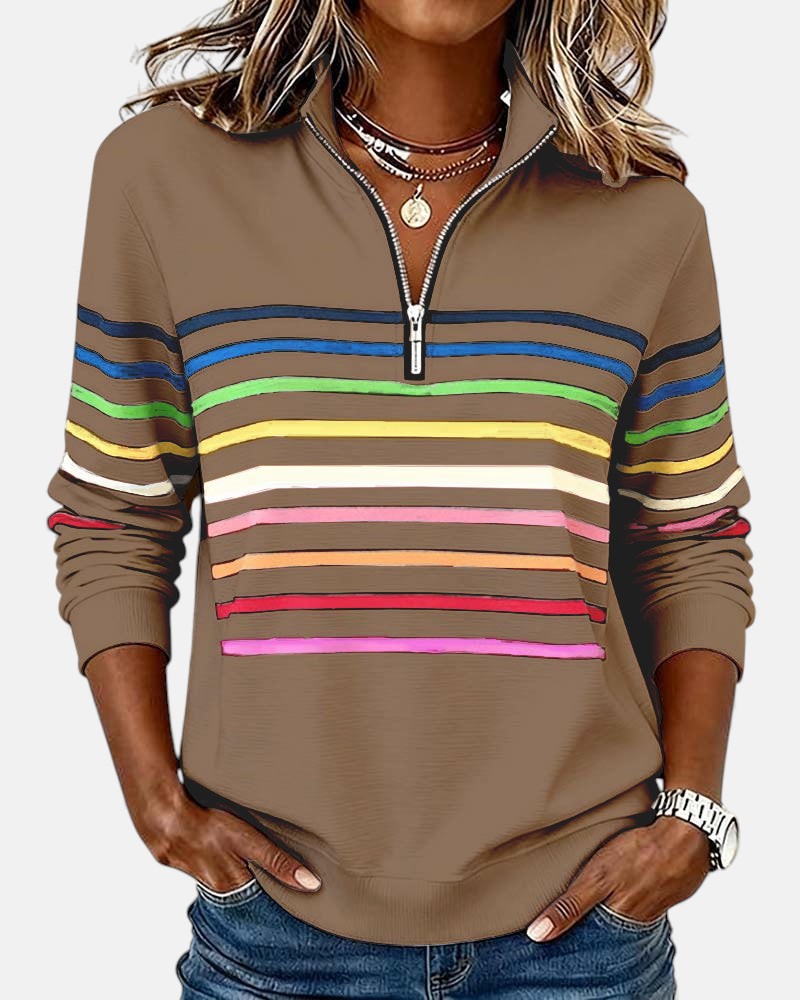 Woman wearing rainbow striped half zip sweatshirt